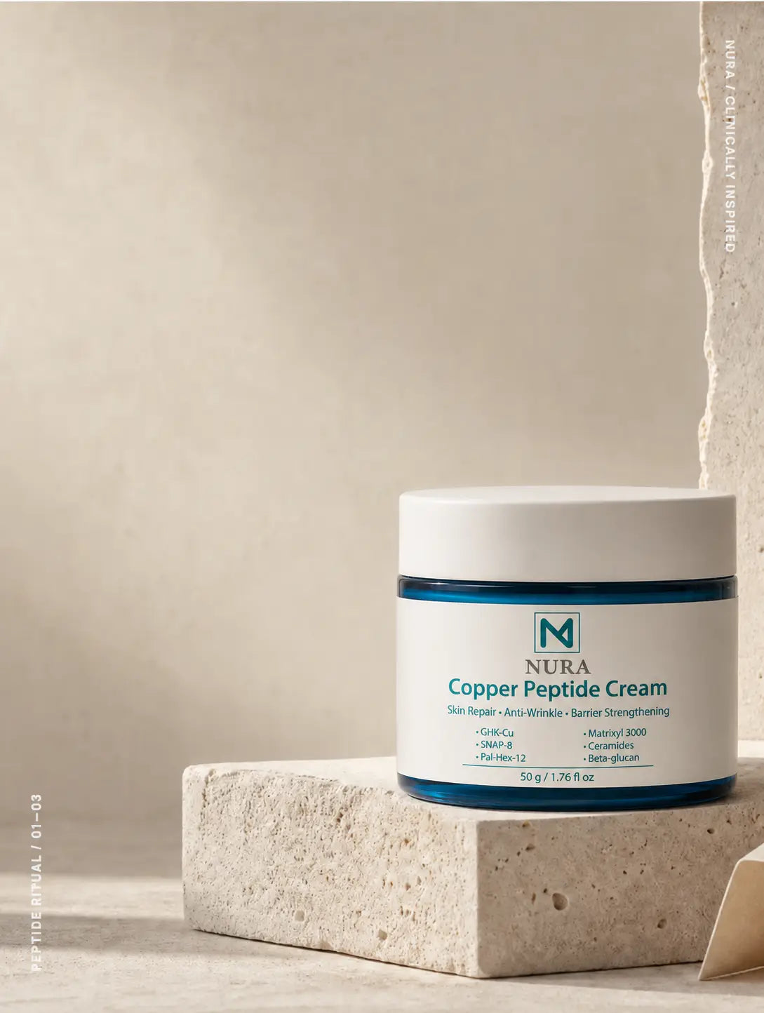 Nura Copper Peptide Cream on a warm stone plinth